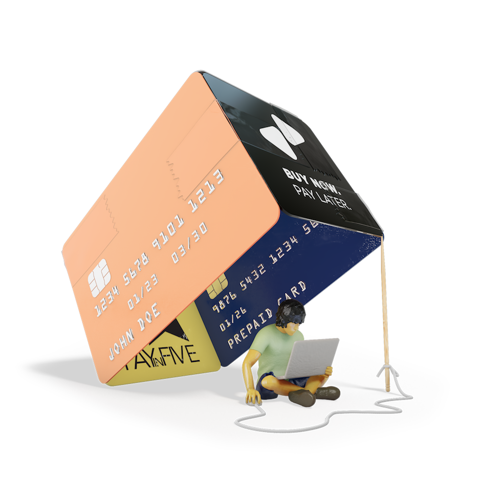 A young person on a laptop sits under a box trap made of credit card and buy now pay later cards. 