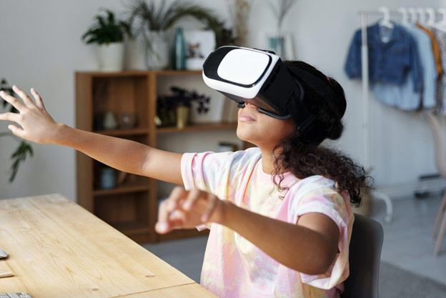 Girl gesturing in VR headset
